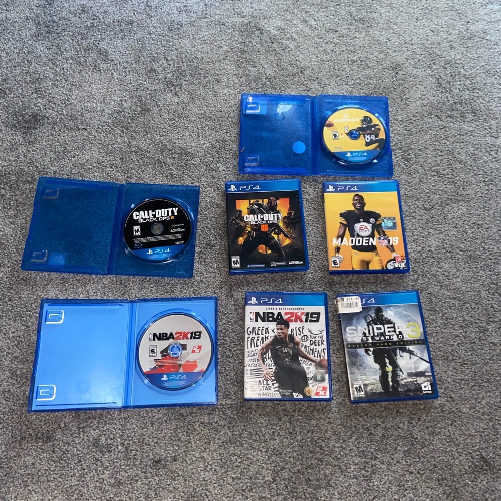 Sony PS4 Game Collection with Blue and Yellow Discs